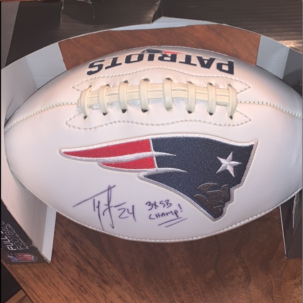 Signed football by Ty Law of The Patriots